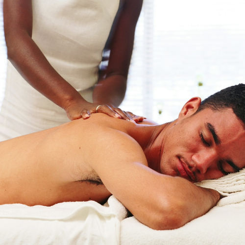 man-getting-deep-tissue-massage-at-his-home-in-las-vegas-from-a-female-mobile-massage-therapist