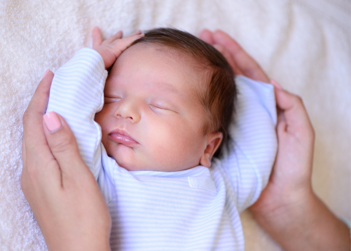 A picture of a baby to represent how prenatal massage can reduce post labor pain